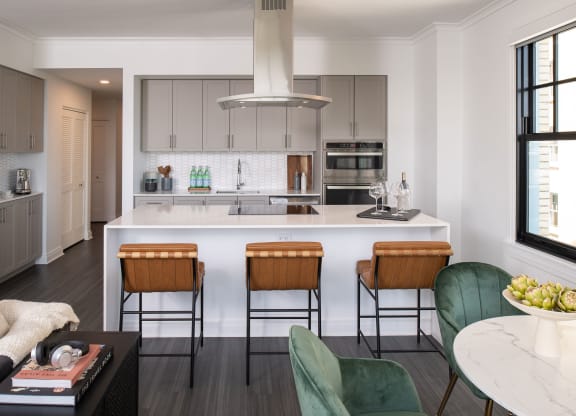 a kitchen with a white counter top and a kitchen island  at The Belden Stratford, Chicago, IL