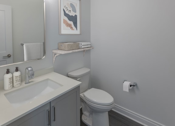 a bathroom with a toilet and a sink and a mirror at The Belden Stratford, Chicago, IL, 60614