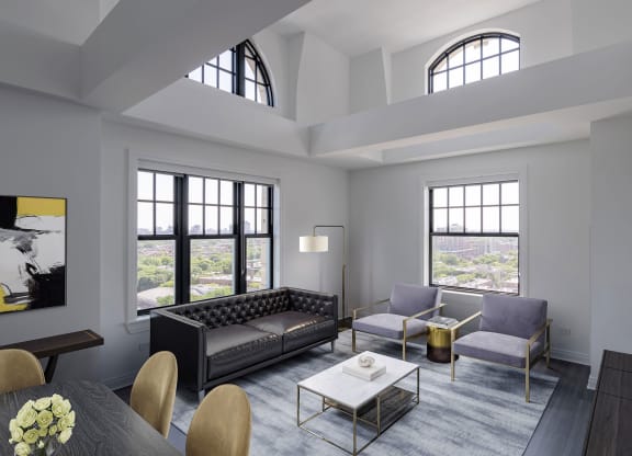 a living room with couches and a table  at The Belden Stratford, Chicago, IL