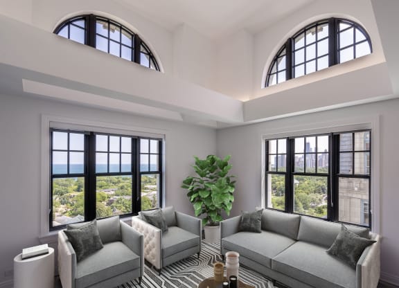 a living room with two couches and two windows  at The Belden Stratford, Chicago, 60614