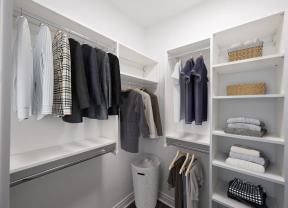 a walk in closet with white shelves and a closet organizer  at The Belden Stratford, Chicago, IL, 60614