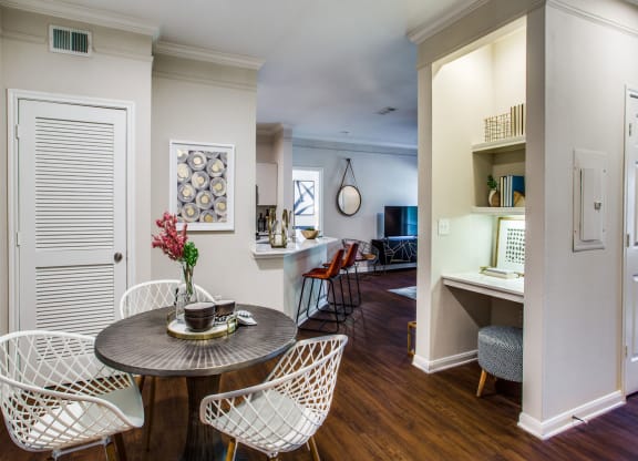 a living room and dining room with a table and chairs at Carrington at Barker Cypress, Texas, 77433