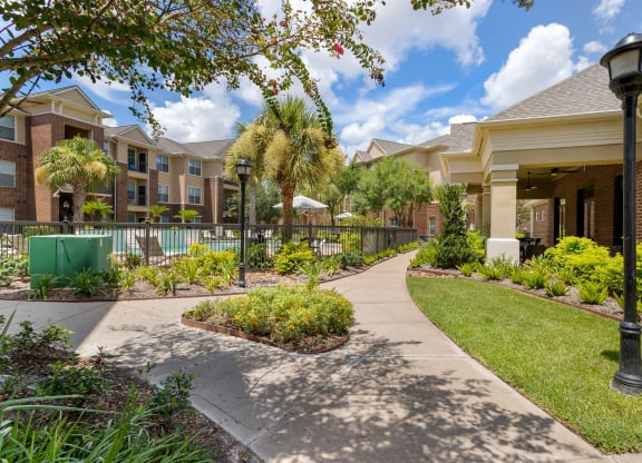 walking path to apartment buildings at Madison on the Meadow, Stafford, Texas