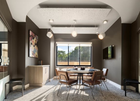 a conference room with a table and chairs and a window at 15 Bank Apartments, White Plains