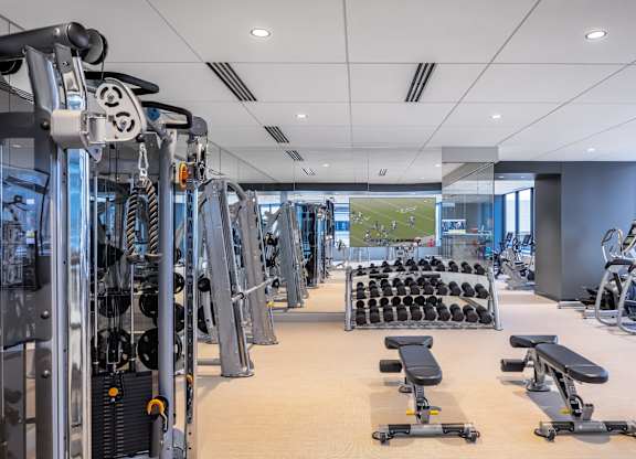 Gym with a variety of equipment including treadmills, weights, and benches at 365 Nicollet, Minneapolis, MN