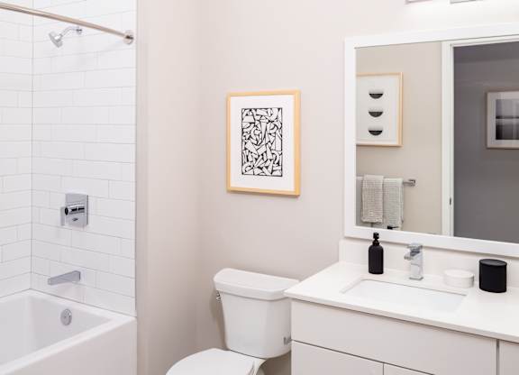 Large Soaking Tub In Bathroom with white cabinets at 365 Nicollet, Minneapolis, 55401