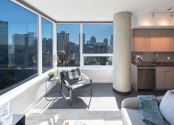 A modern living room with a view of the city skyline.