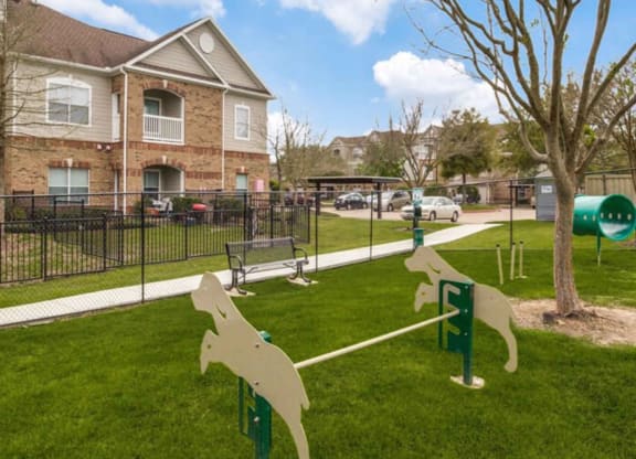 a dog park in front of a house at Carrington at Barker Cypress, Cypress