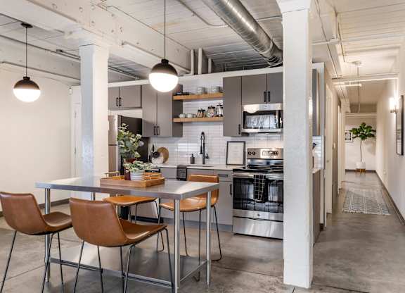 a kitchen and dining area in a loft at Highland Mill Lofts, Charlotte, North Carolina