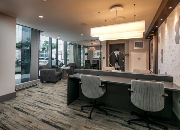 a conference room with chairs and a table and a large window at The Grand Central, Chicago, 60607