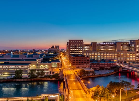 an aerial view of the city at night at The Grand Central, Chicago, 60607