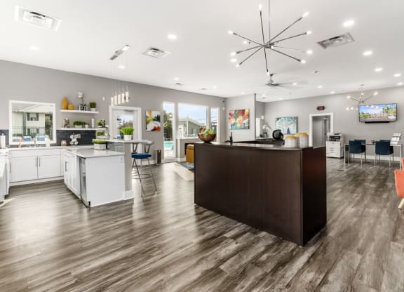 A modern kitchen with a large island and a bar area at Estates at Brentwood Lake Apartments, Ohio, 43068