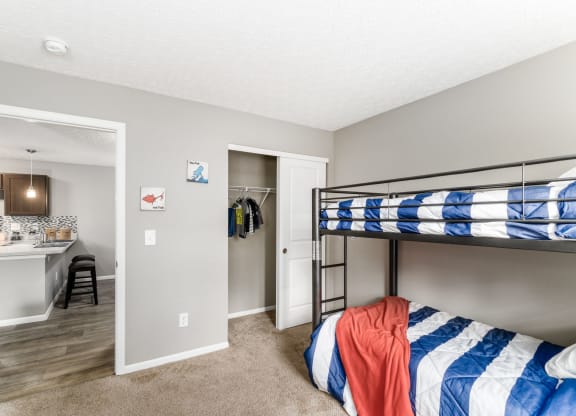 A bedroom with a bunk bed and a desk at Estates at Brentwood Lake Apartments, Reynoldsburg, Ohio