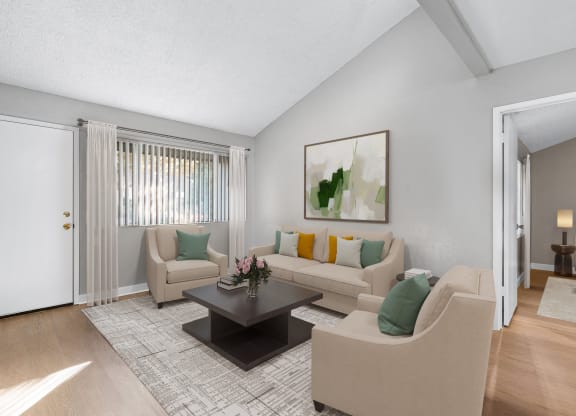 a living room with couches and a coffee table