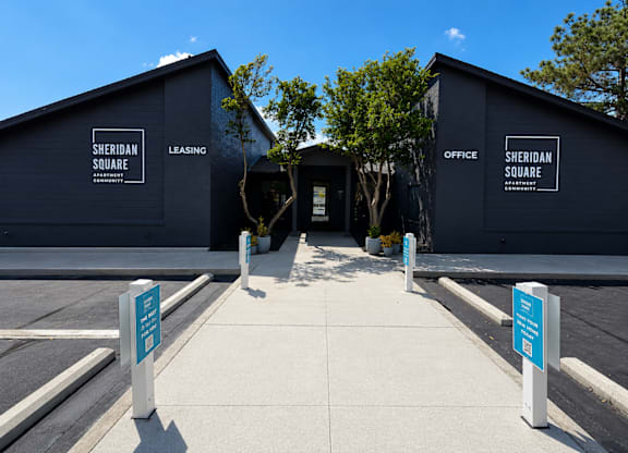 The image shows the entrance to Sheridan Square with two buildings labeled as Leasing and Office.