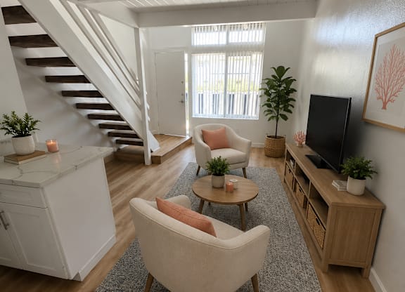 A living room with a white sofa and a wooden floor.