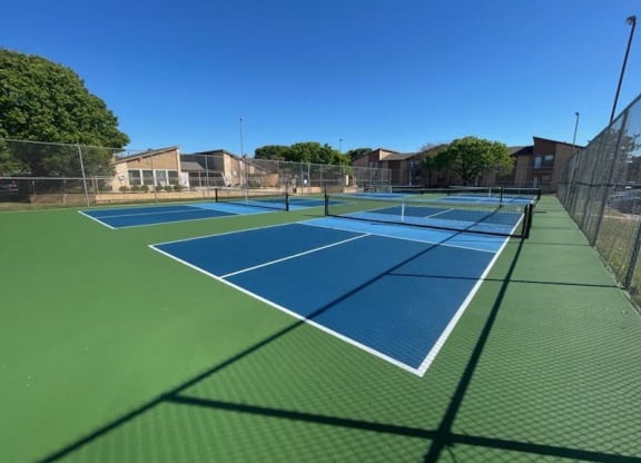 a tennis court with blue and green courts on it