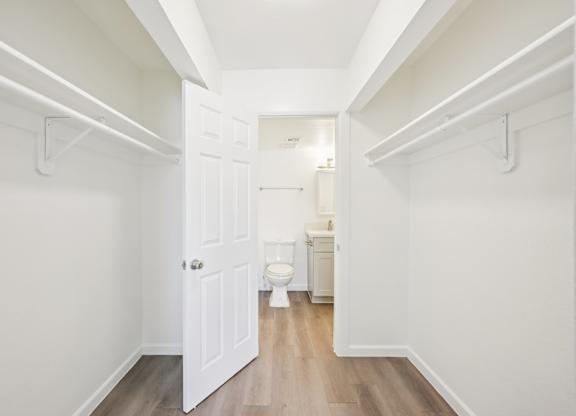A white door is open to a bathroom.