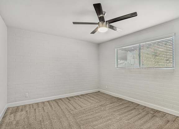 Bedroom with ceiling fan and carpeted floor at Palm Villas, Arizona