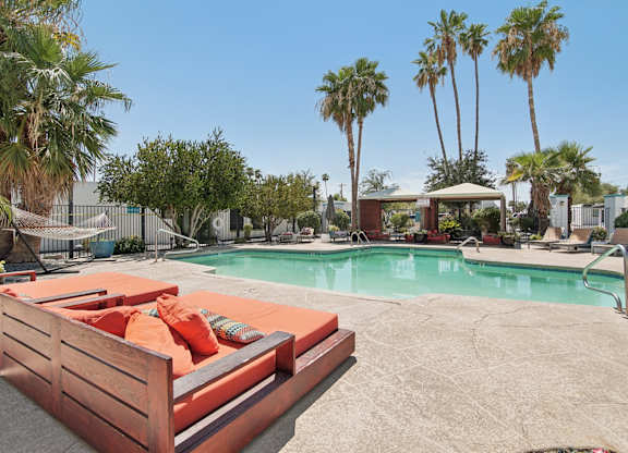 Pool area with sun lounger at Palm Villas, Scottsdale, AZ