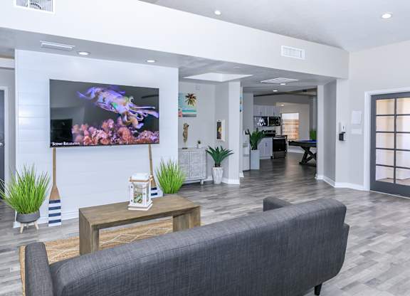 a living room with a couch and a tv at Tides at Mesa, Mesa