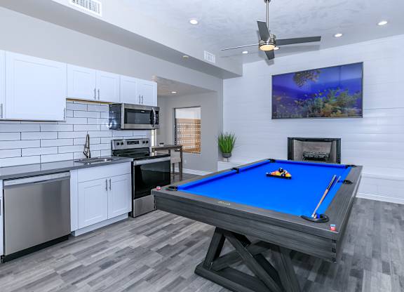 a games room with a pool table and a kitchen at Tides at Mesa, Arizona