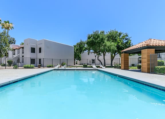 a large swimming pool with a building in the background at Tides at Mesa, Mesa, AZ, 85204