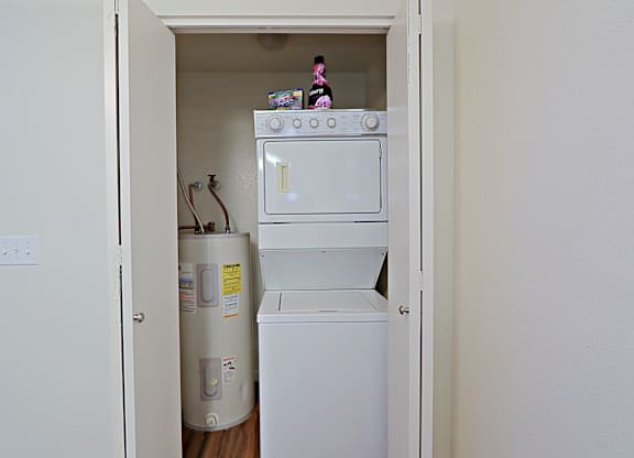 a small laundry room with a washer and dryer