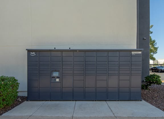 A large grey garage door with a small white sign on it.
