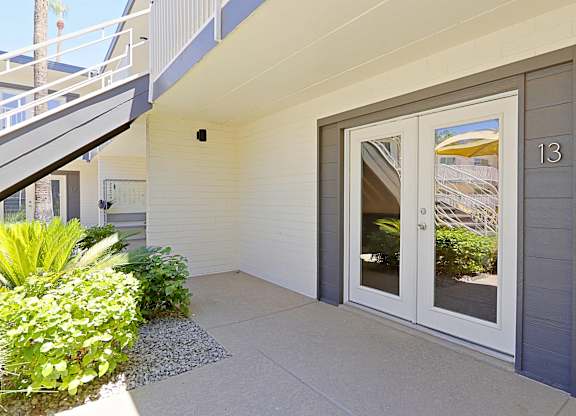 Double frech doors that open to a private patio space