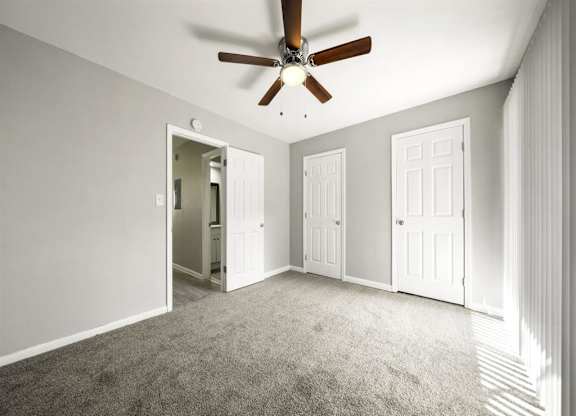 Master bedroom with ceiling fan and light1 at Georgian Oaks Apartments l & ll* Apartments, Georgia