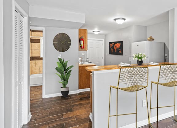 a kitchen with a bar counter at Gardens at Washington Park, Atlanta, GA