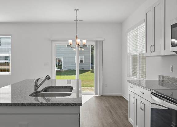 a kitchen with a sink and a window