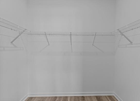 A wire sculpture of a bird is suspended from the ceiling.