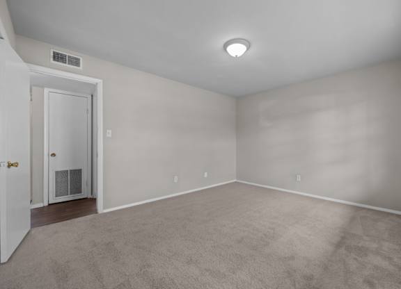 A room with a door and a window.