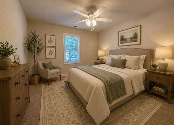 A bedroom with a large bed, a chair, and a ceiling fan.