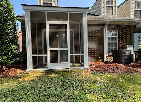 A house with a white door and windows.