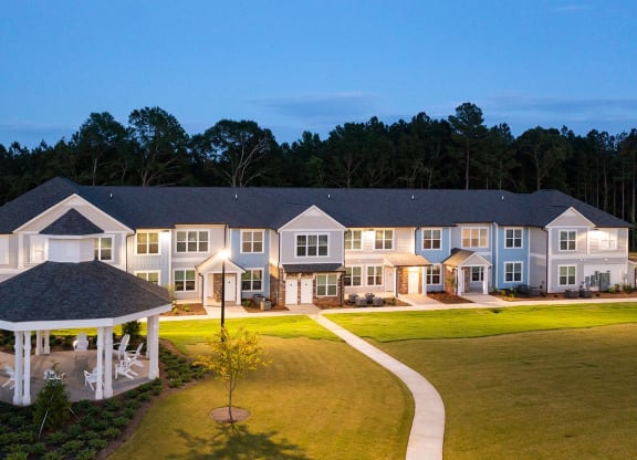 Exterior building and Gazebo with walkway at twilight at Carmel Vista, McDonough, 30253