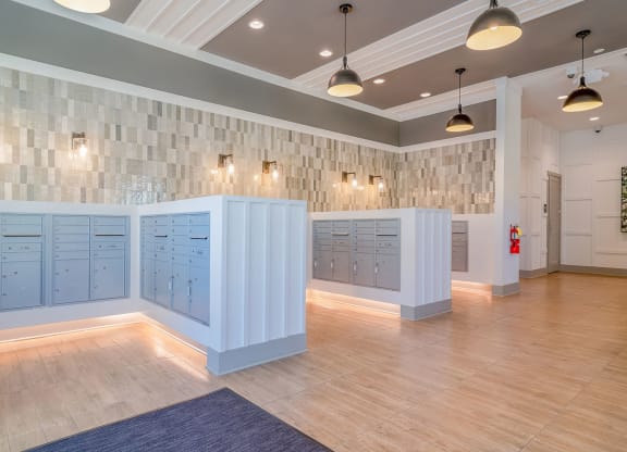 the locker room at the gym has blue lockers and a wood floor at Carmel Vista, McDonough, GA