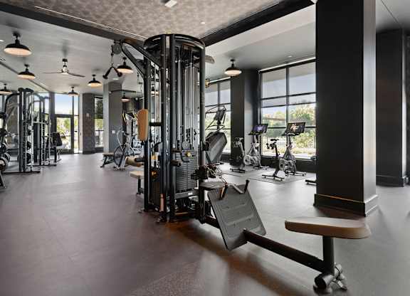 the gym has weights machines and other exercise equipment