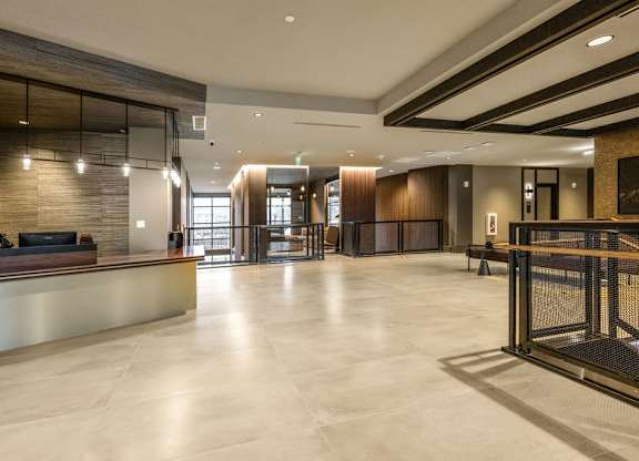 the lobby of a hotel with a reception desk