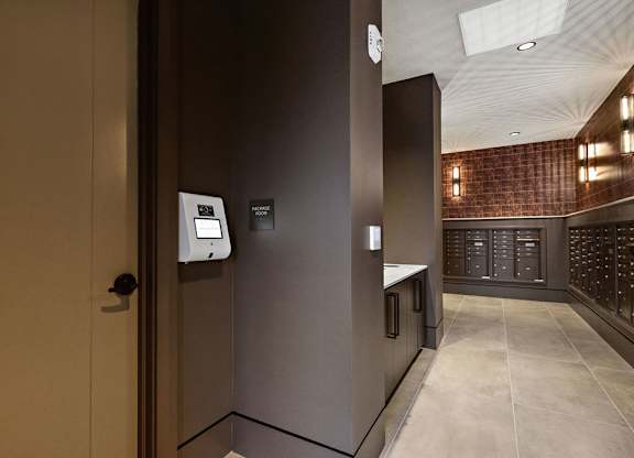 a view of a hallway with a door to a wine cellar
