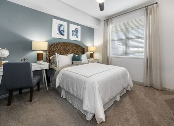 a bedroom with a bed and a desk at Inspira, Florida, 34113