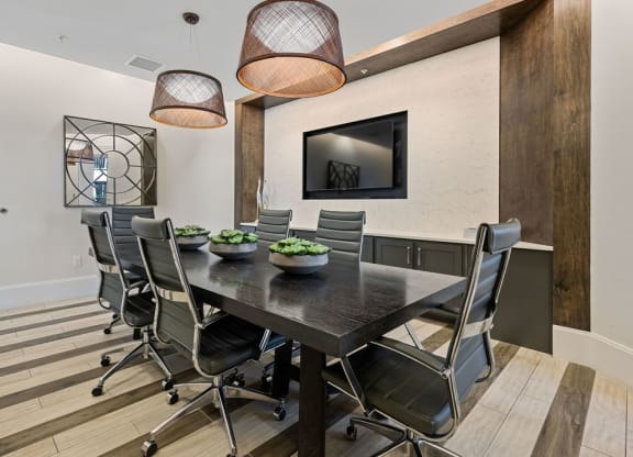 Conference table with TV for presentations available for use by residents at Inspira, Florida