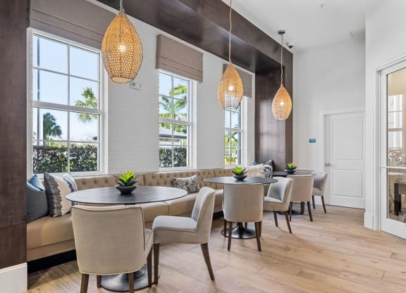 Booth type seating with tables and chairs at Inspira, Florida, 34113