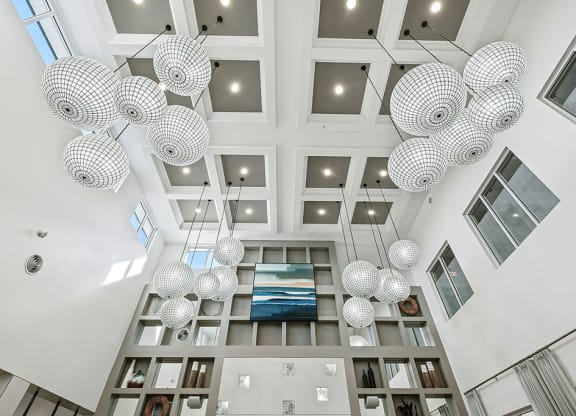 a view of the lobby of a building with spheres hanging from the ceiling at Inspira, Florida, 34113