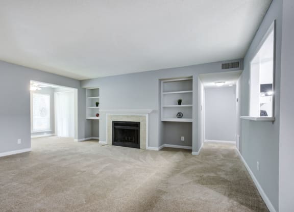 vacant renovated apartment-fireplace in living room at Laurel Oaks, North Carolina