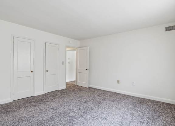 Senior-friendly bedroom at Park View at Towson with two doors and natural light