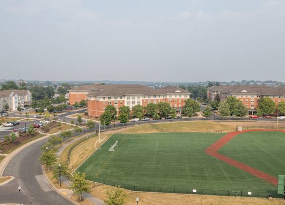 a baseball field in front of a building