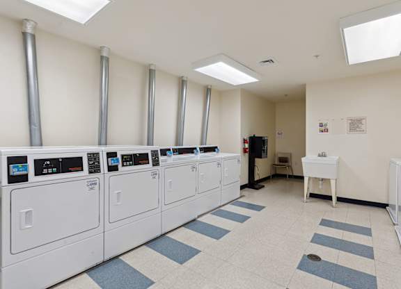 a room filled with washers and dryers